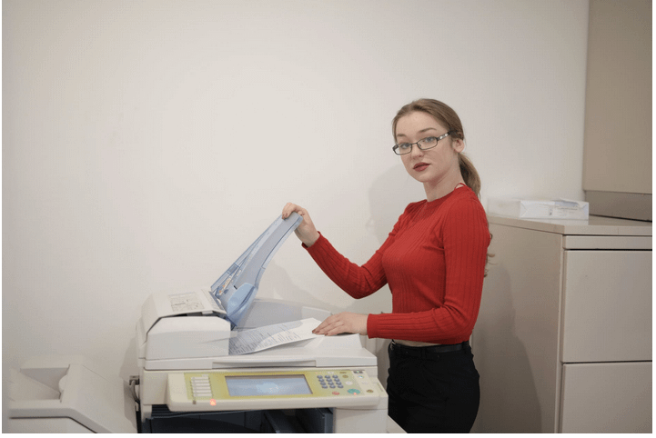 a lady using a printer